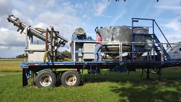 ARS support scientist, Sarah Fishel adjusting the centrifuge speed of the MAPHEX system