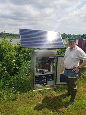 ARS soil scientis Gregory McCarty checking equipment that measures carbon in the Tuckahoe Creek Watershed