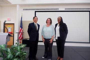 Simon Liu and Deirdra Chester pose with ARSX contest winner Erin Legacki. 