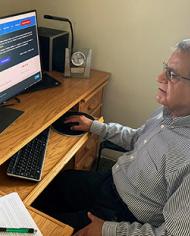 ARS microbiologist, Vijay Juneja at his computer reviewing ComBase.